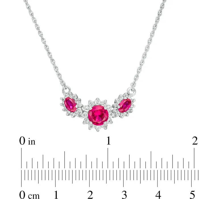 Goldia Necklaces Oval and Round LabCreated Ruby and White Sapphire Sunburst Frame Three Stone Necklace in Sterling Silver