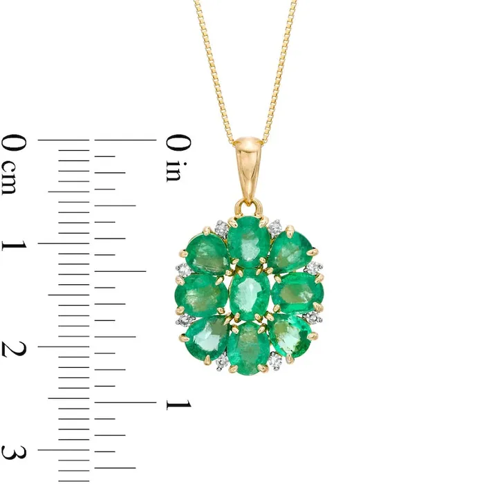 Oval and PearShaped Emerald and 005 CT TW Natural Diamond Flower Pendant in 10K Yellow Gold Goldia Necklaces